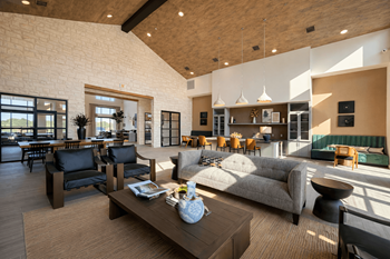 Community clubhouse with high ceilings and lounge seating